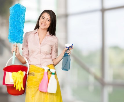 Cleaner using PPE during a carpet cleaning job