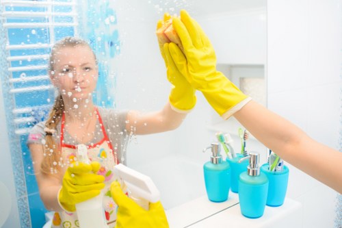 Professional cleaners maintaining a meeting room in Barnet office premises