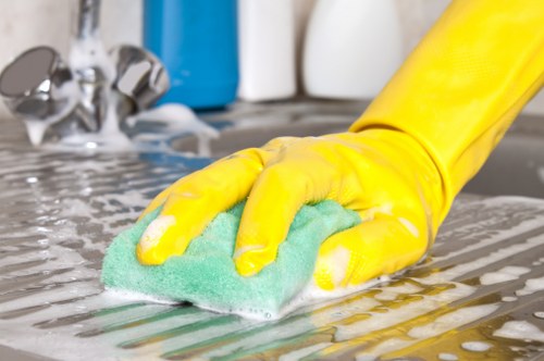 Local cleaners deep cleaning a kitchen during a move-out service in Barnet