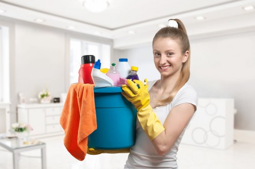 Local cleaner treating stains on a sofa in Barnet